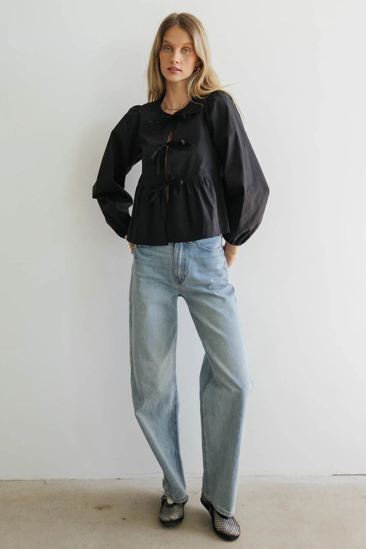 Blouse paired with light wash denim