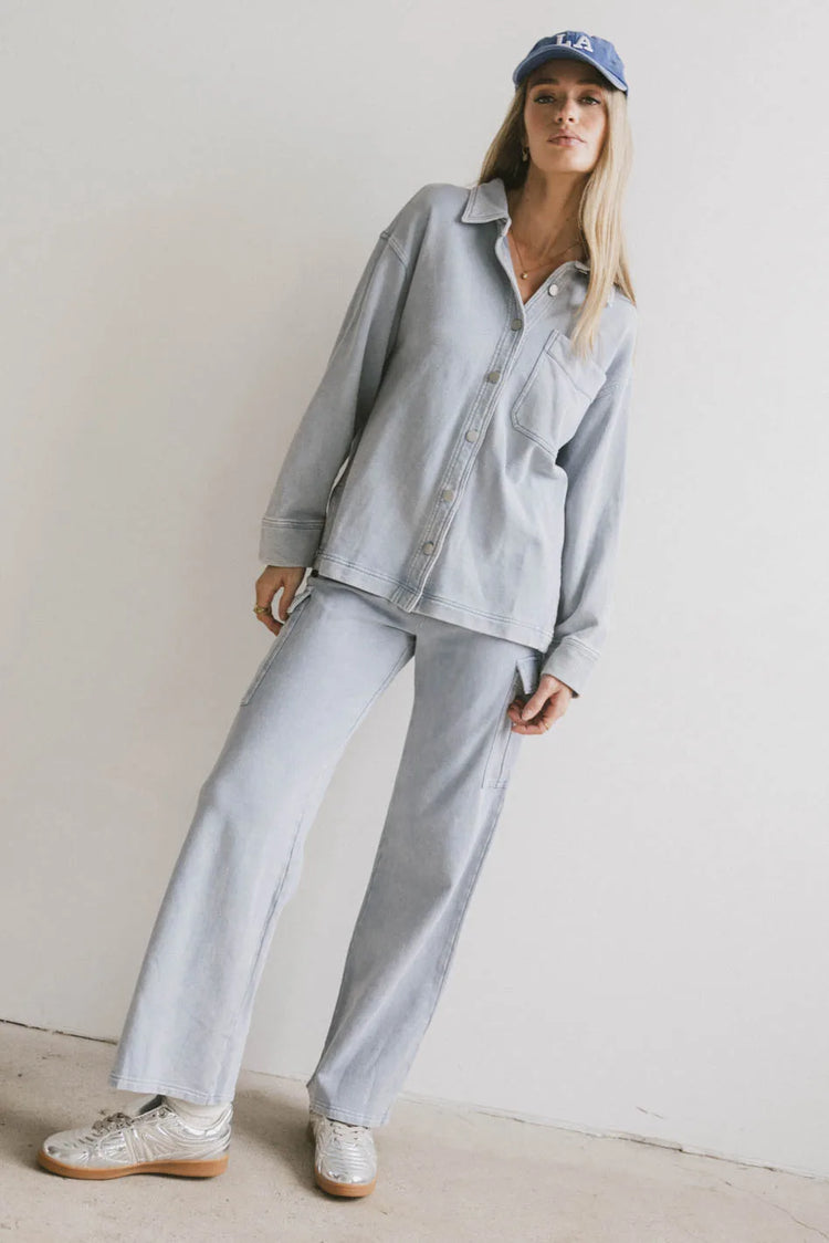 Pants in blue paired with a button up top in blue