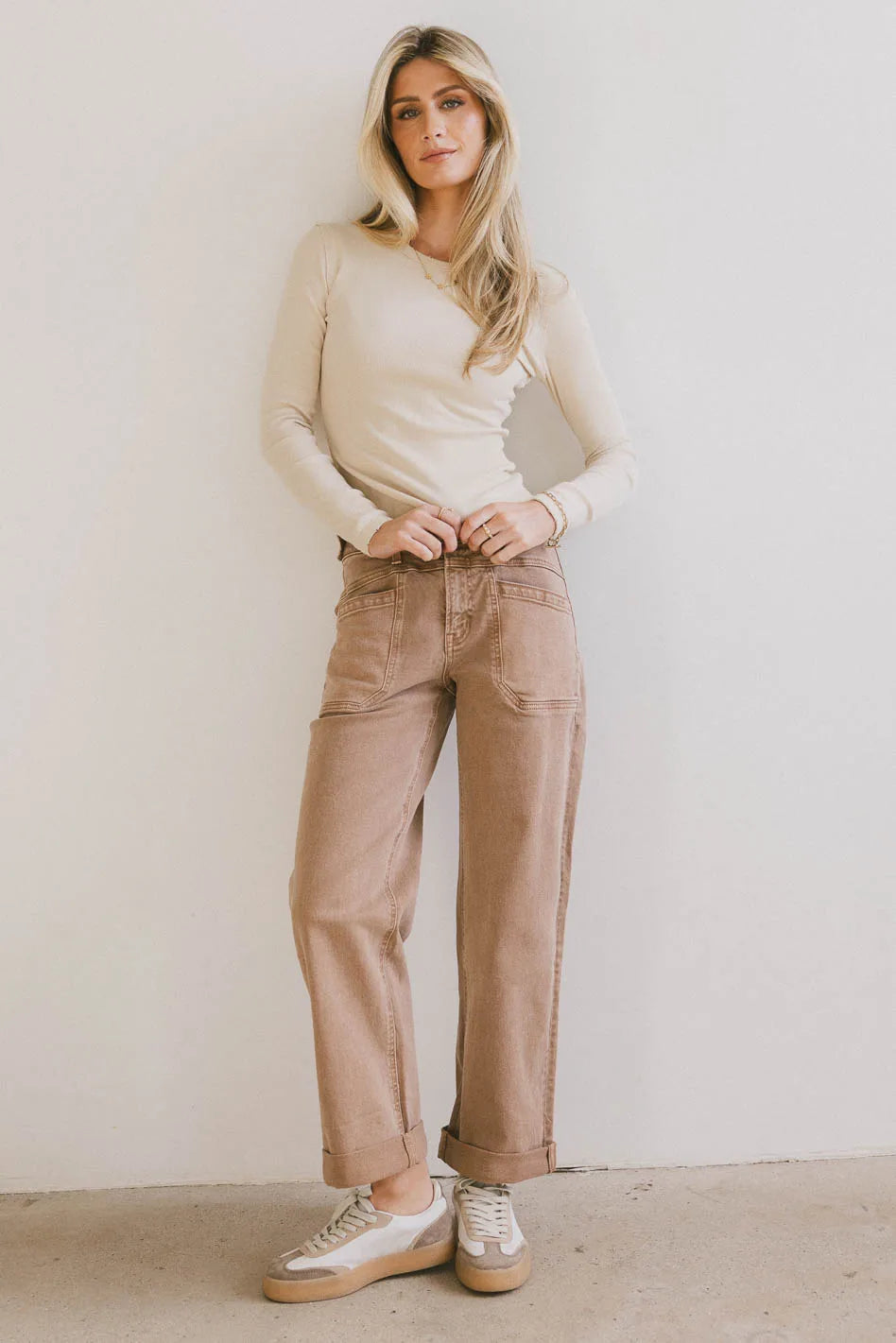 Basic top in cream paired with a brown denim