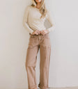Basic top in cream paired with a brown denim