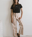 Top in black paired with a striped pants
