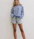 Top in blue paired with a denim short