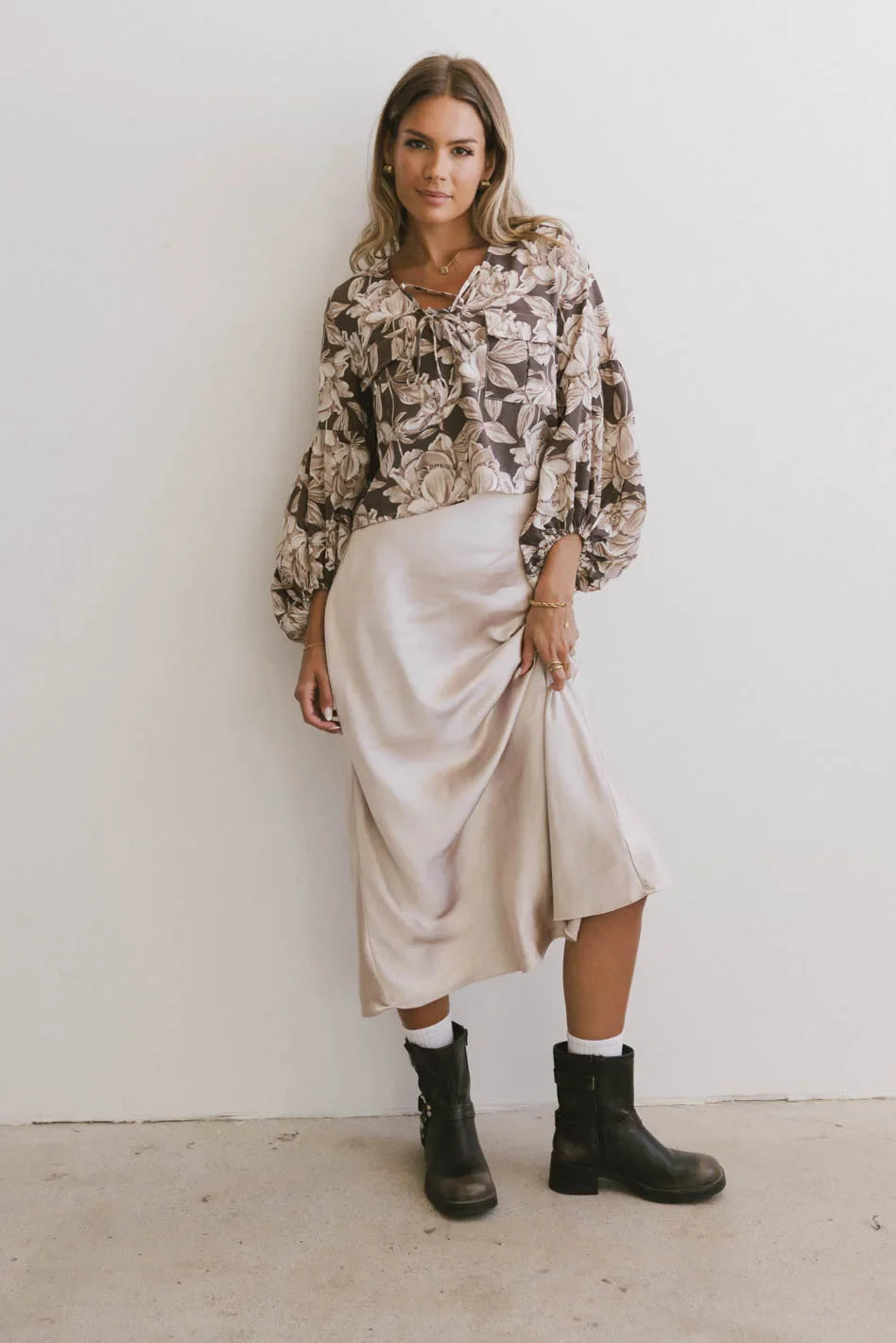 Top paired with a skirt in beige