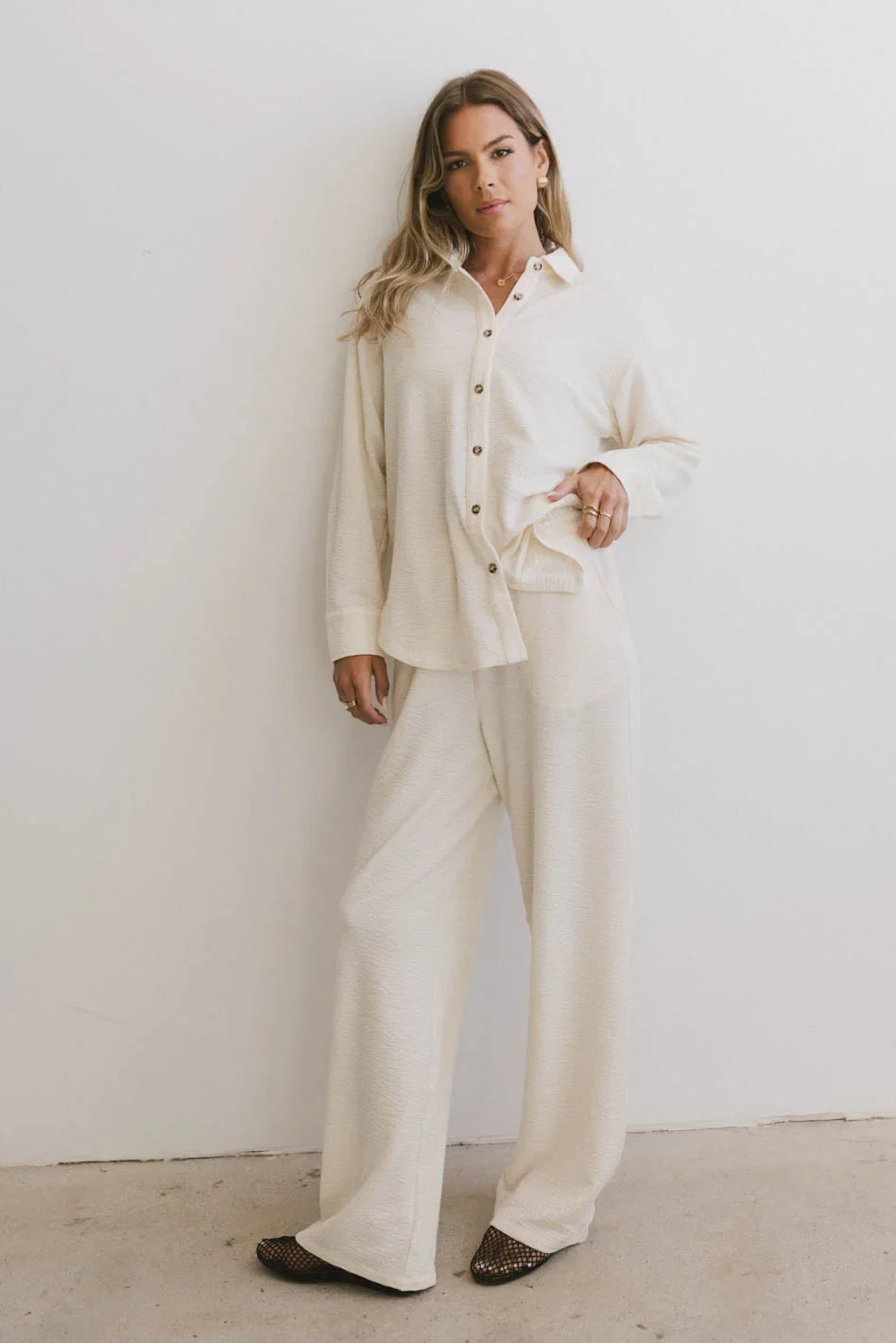 Cream pants paired with a cream top