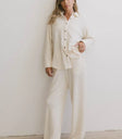 Cream pants paired with a cream top