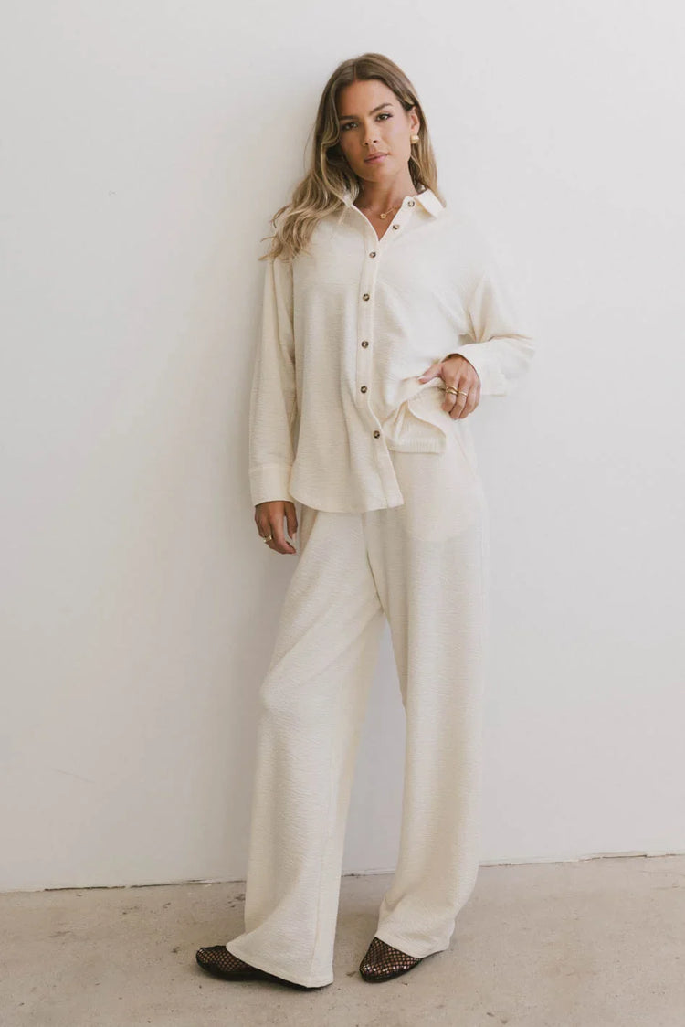 Cream pants paired with a cream top
