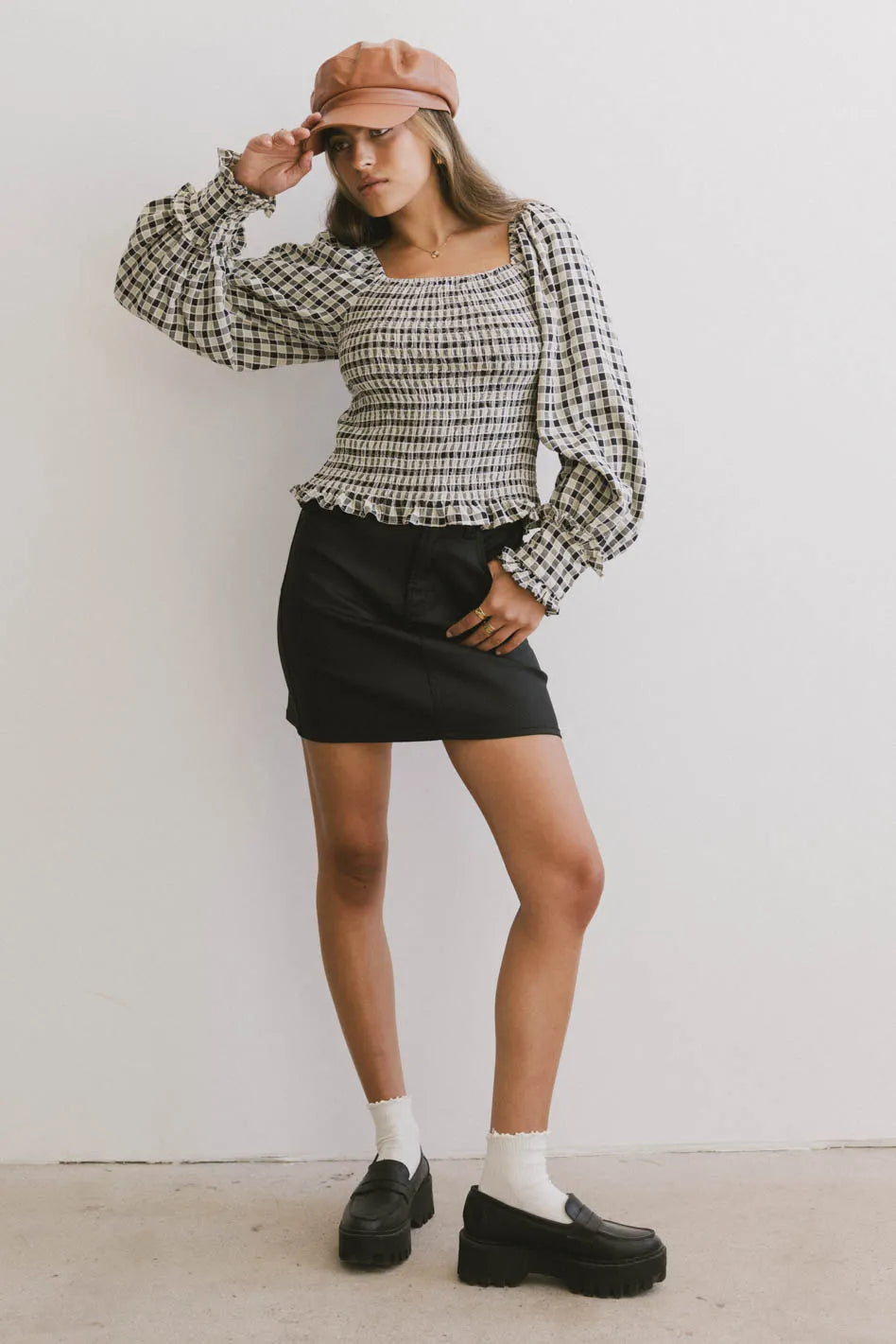 Top in black paired with a black skirt