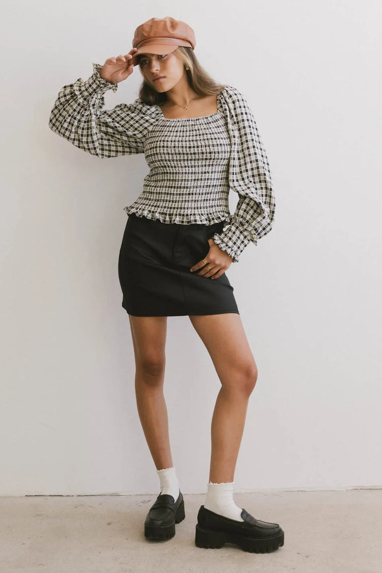 Top in black paired with a black skirt
