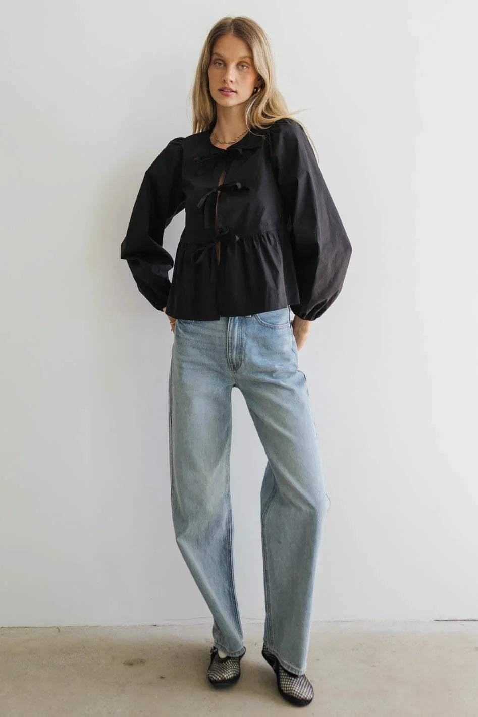 Blouse paired with light wash denim