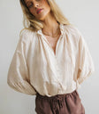 Ruffled round neck blouse in cream