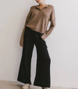Knit top in brown paired with a wide leg pants in black
