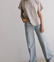 Top in taupe paired with a light denim top