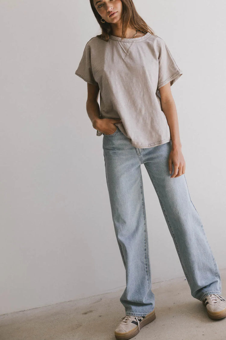 Top in taupe paired with a light denim top