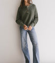 green ribbed sweater