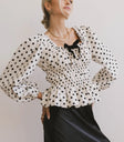 Polka dots top in cream