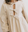 FRONT BOW DRESS IN CREAM