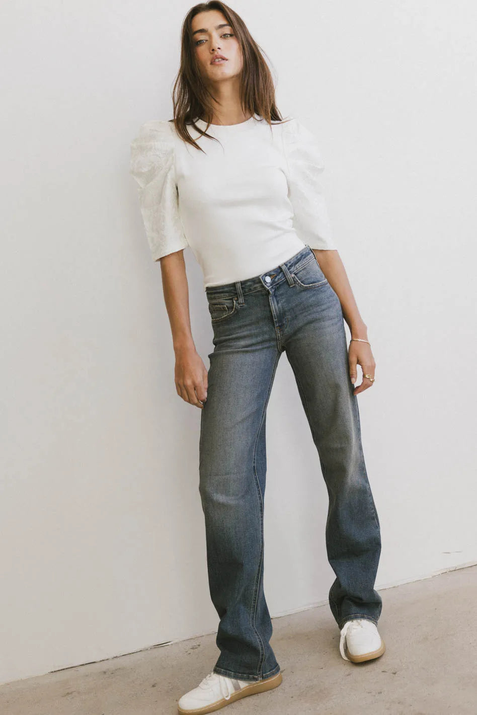 Denim pants paired with a white top