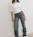 Denim pants paired with a white top