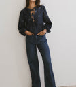 bow print top with dark denim