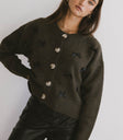 button front cardigan in olive with black bows