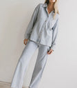 Pants in blue paired with a button up top in blue