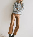 Pants in camel paired with a denim top