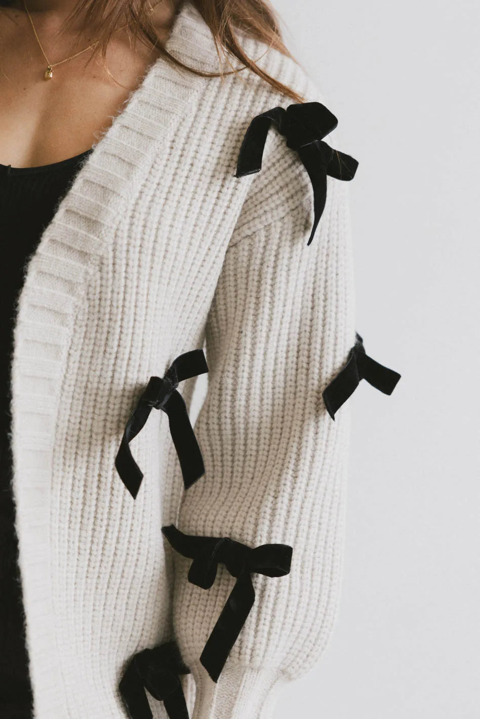 Cardigan with velvet bows