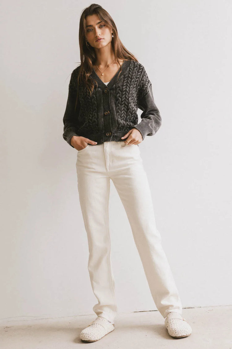 Cardigan in black paired with a cream pants