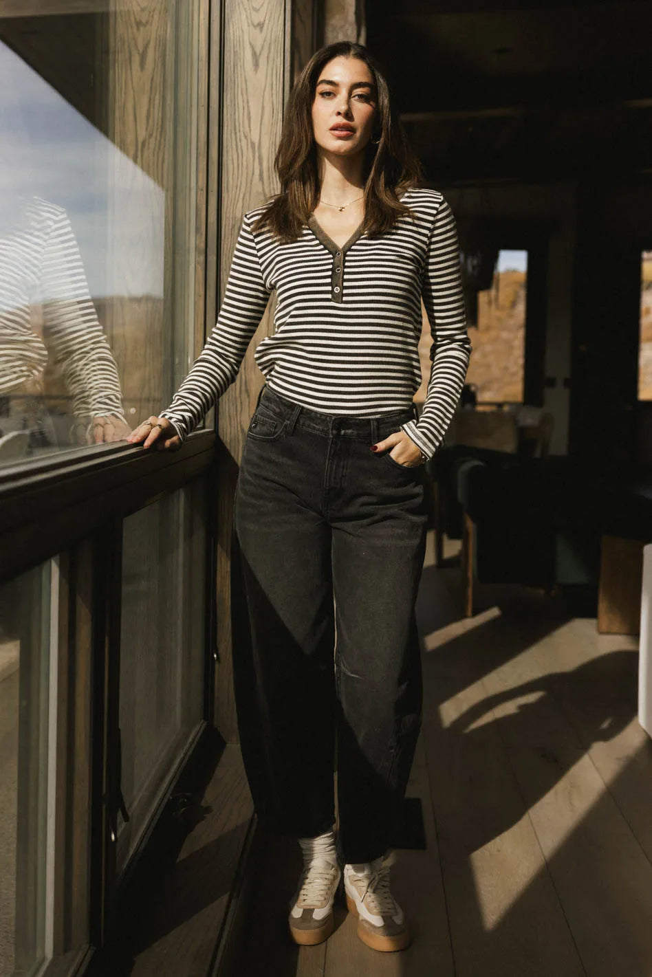 Striped to in black paired with denim