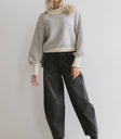Sweater in ivory paired with a black denim
