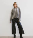 Sweater in black paired with a faux leather bottom