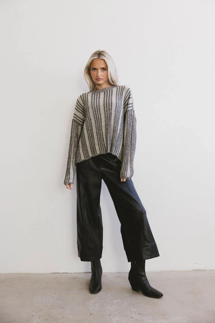 Sweater in black paired with a faux leather bottom