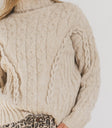 TURTLENECK CABLE KNIT SWEATER