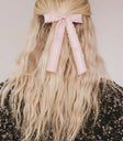Wav edges bow in pink