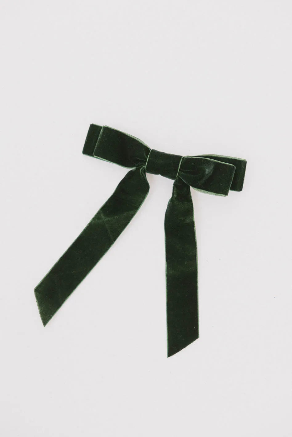 Double velvet bow in green