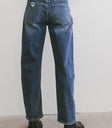 medium wash denim jeans in barrel style