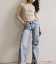 Striped top in beige paired with light denim
