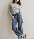 Mock neck sweater paired with a denim