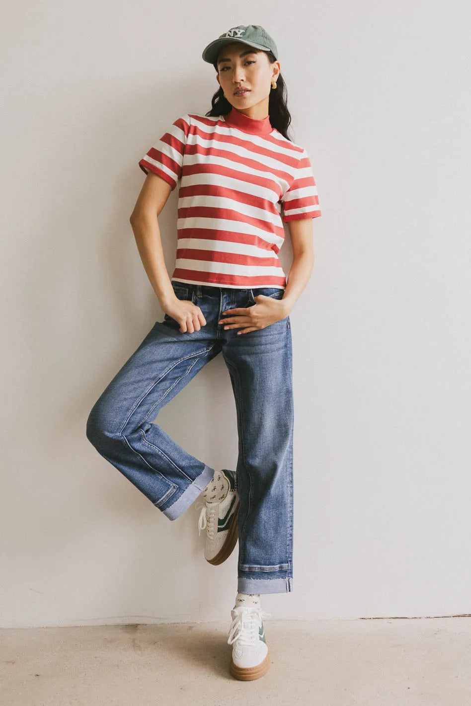 Striped top paired with denim jeans