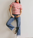 Striped top paired with denim jeans