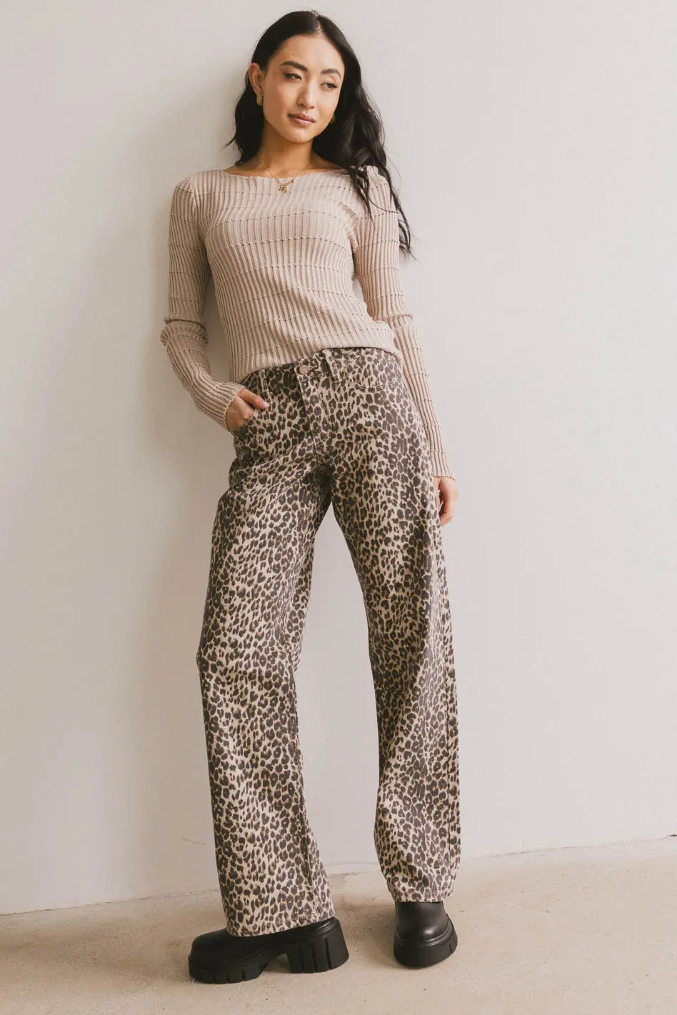 Striped top in tan paired with a leopard print denim