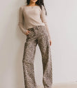 Striped top in tan paired with a leopard print denim