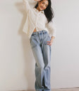 Top in cream paired with light wash denim