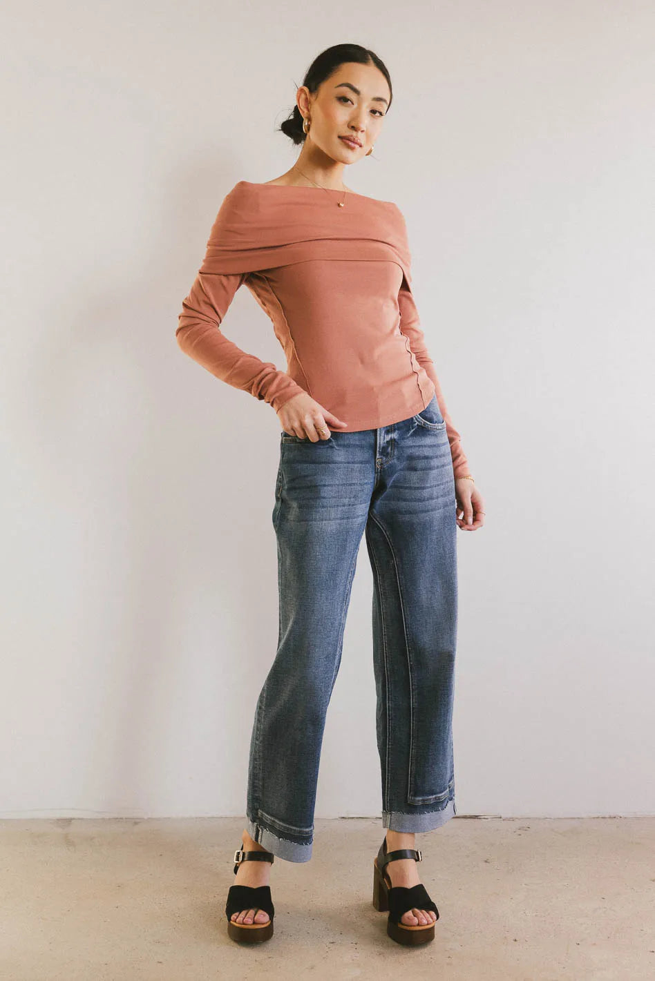 Knit top in terracotta paired with denim
