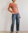 Knit top in terracotta paired with denim