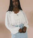 Front ruffle top in cream