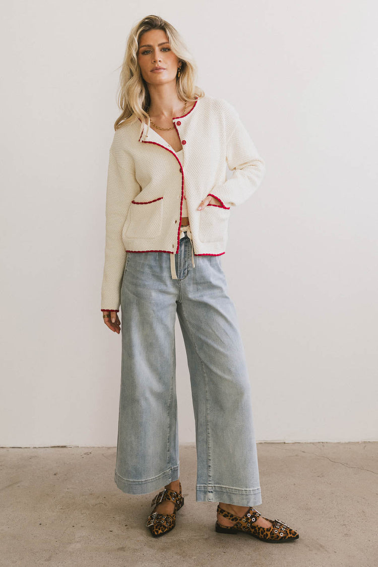 Cream cardigan paired with light denim