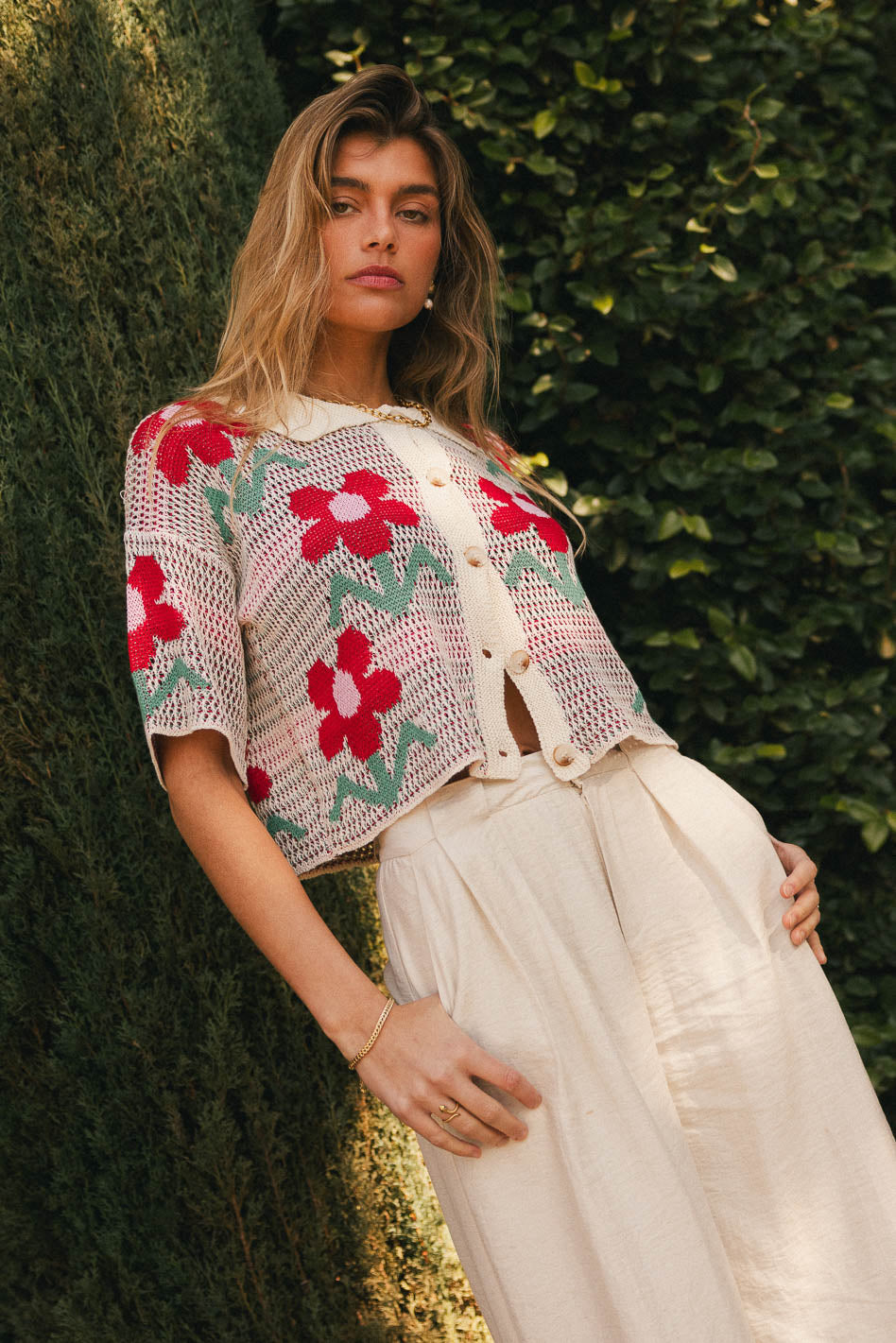 Cream top with red flowers