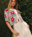 Cream top with red flowers