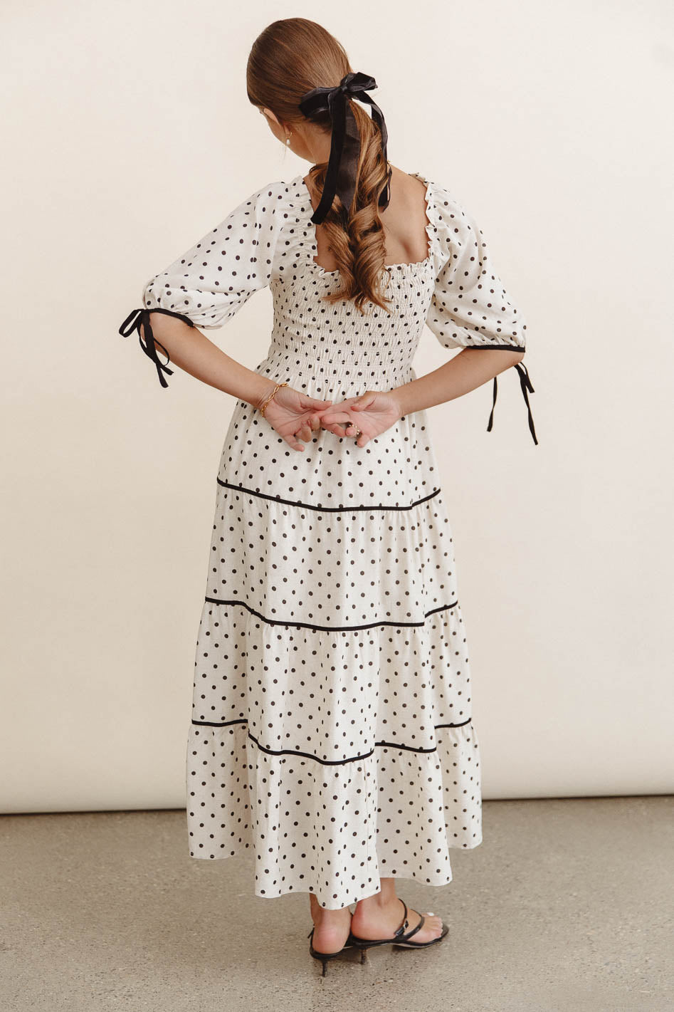 Polka dot dress styled in cream